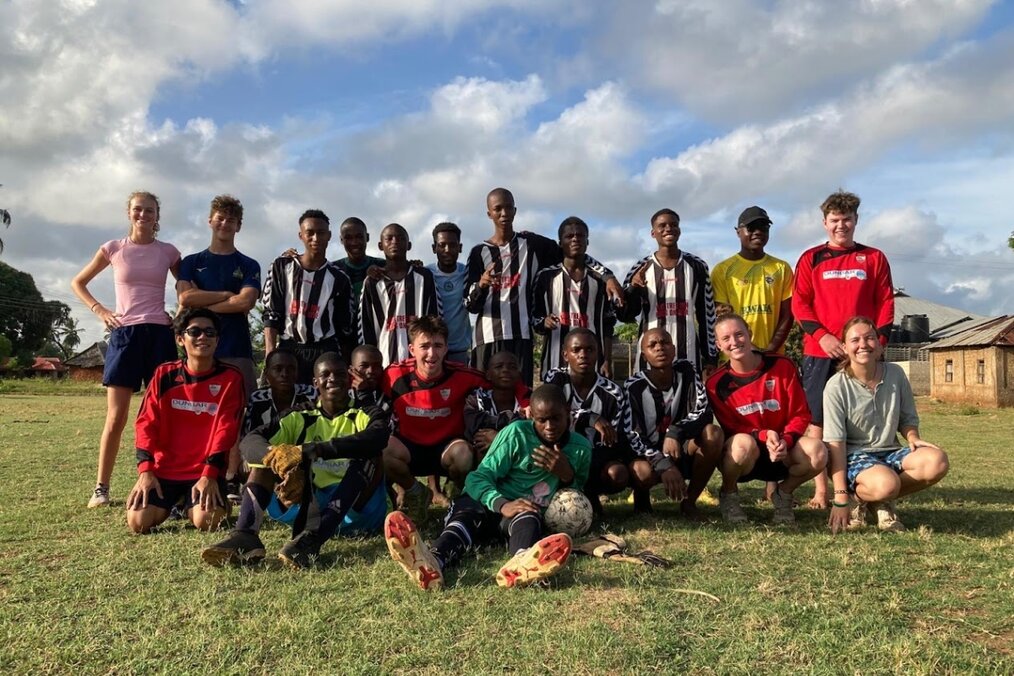A team of soccer players posing for a team photo